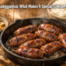 Freshly cooked Vigan Longganisa sausages in a pan with sukang Iloko dipping sauce and white rice