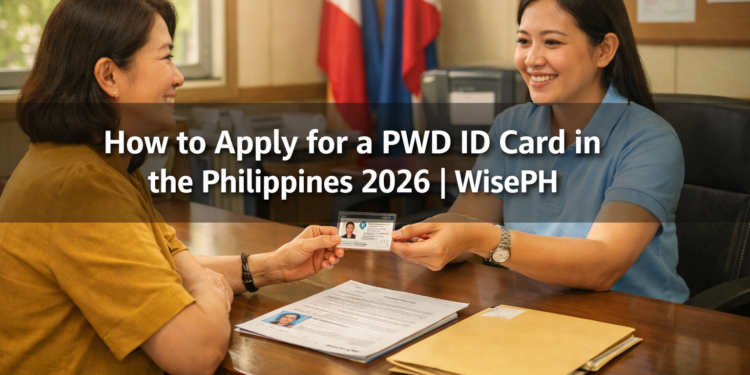 A Filipino woman receives her PWD ID card from a government staff member at an MSWDO office in the Philippines.