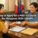 A Filipino woman receives her PWD ID card from a government staff member at an MSWDO office in the Philippines.