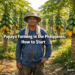 Filipino farmer standing in a commercial papaya farm in the Philippines with rows of papaya trees bearing ripe and green fruit.