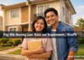 Filipino couple in front of a new townhouse after Pag-IBIG housing loan approval in 2026