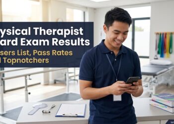 A young Filipino physical therapy graduate smiles at his phone in a rehabilitation clinic, checking the physical therapist board exam results.
