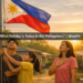 A Filipino family raises the Philippine flag in front of their home