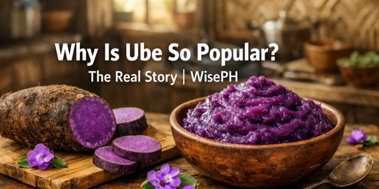 A bowl of freshly made Filipino ube halaya beside a raw ube tuber on a wooden table, showcasing the deep purple color of real Dioscorea alata.