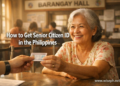 A Filipino senior citizen receiving her laminated Senior Citizen ID card from a municipal hall employee.