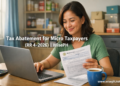 A Filipino small business owner reviews BIR tax documents at her home desk while considering the new micro taxpayer abatement program.