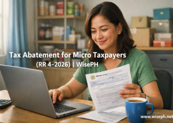 A Filipino small business owner reviews BIR tax documents at her home desk while considering the new micro taxpayer abatement program.