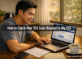 A Filipino man checks his SSS loan balance and contribution history on the My.SSS portal on his laptop at a home office desk.